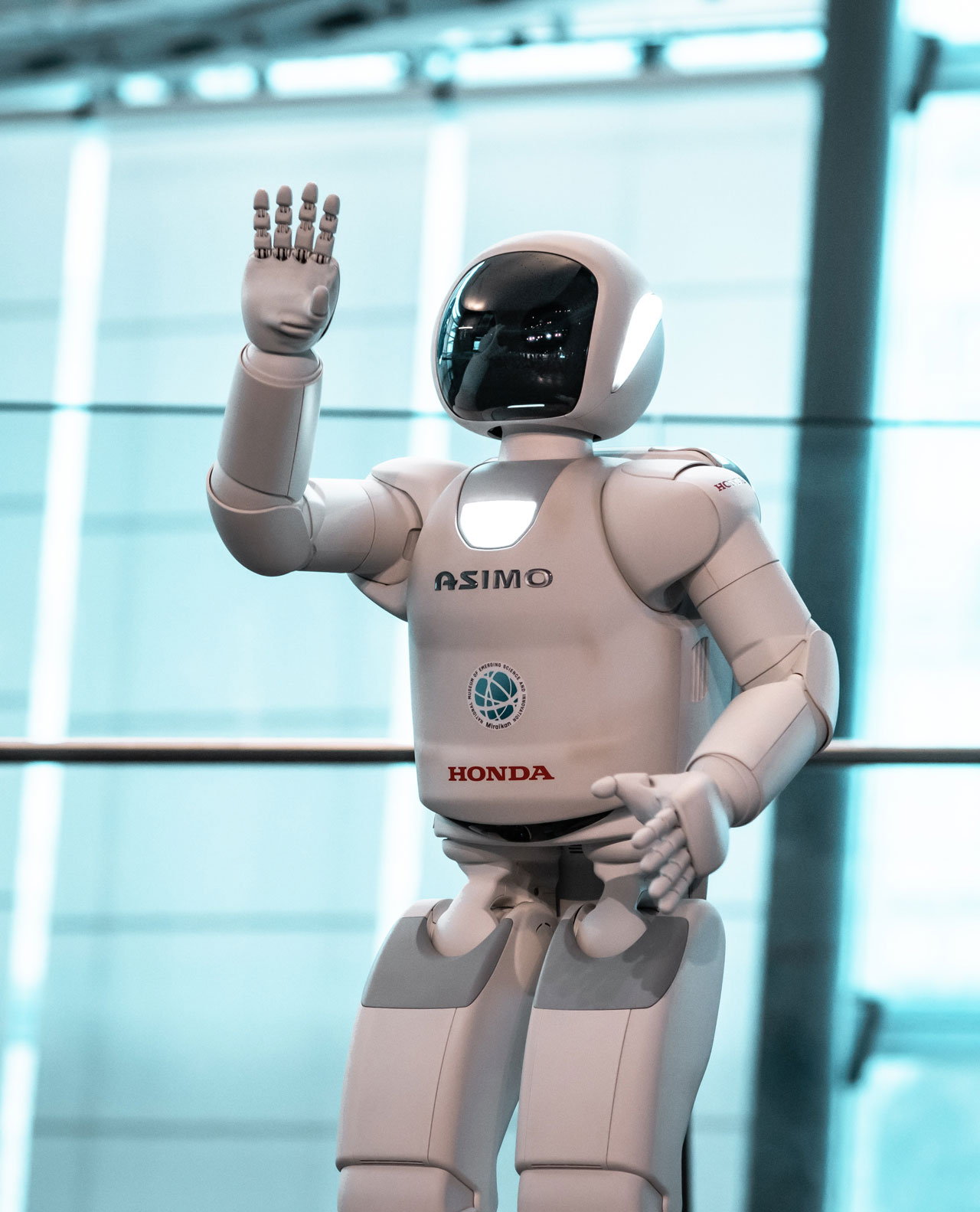 A friendly robot greeting people.