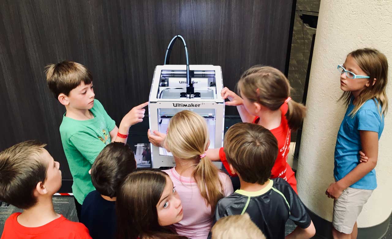 A group of children learning about technology